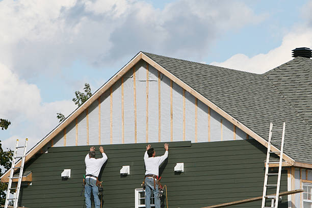 Professional Storm Damage Siding Repair technician working in Dresher, PA